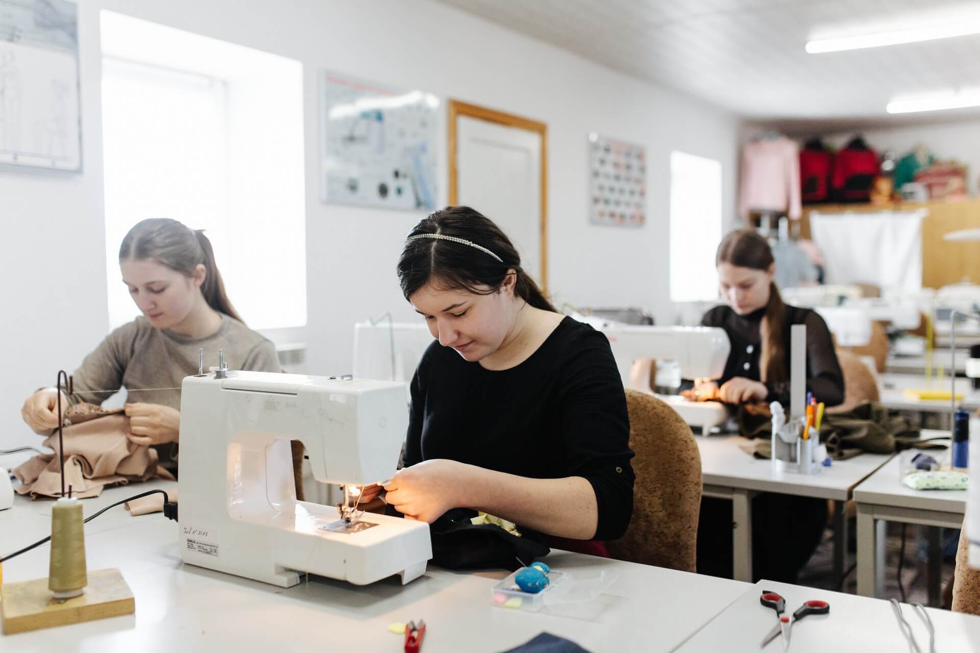 Ukrainian women learning how to sew 