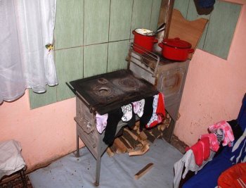 The family's wood-burning stove is used for both cooking and heating